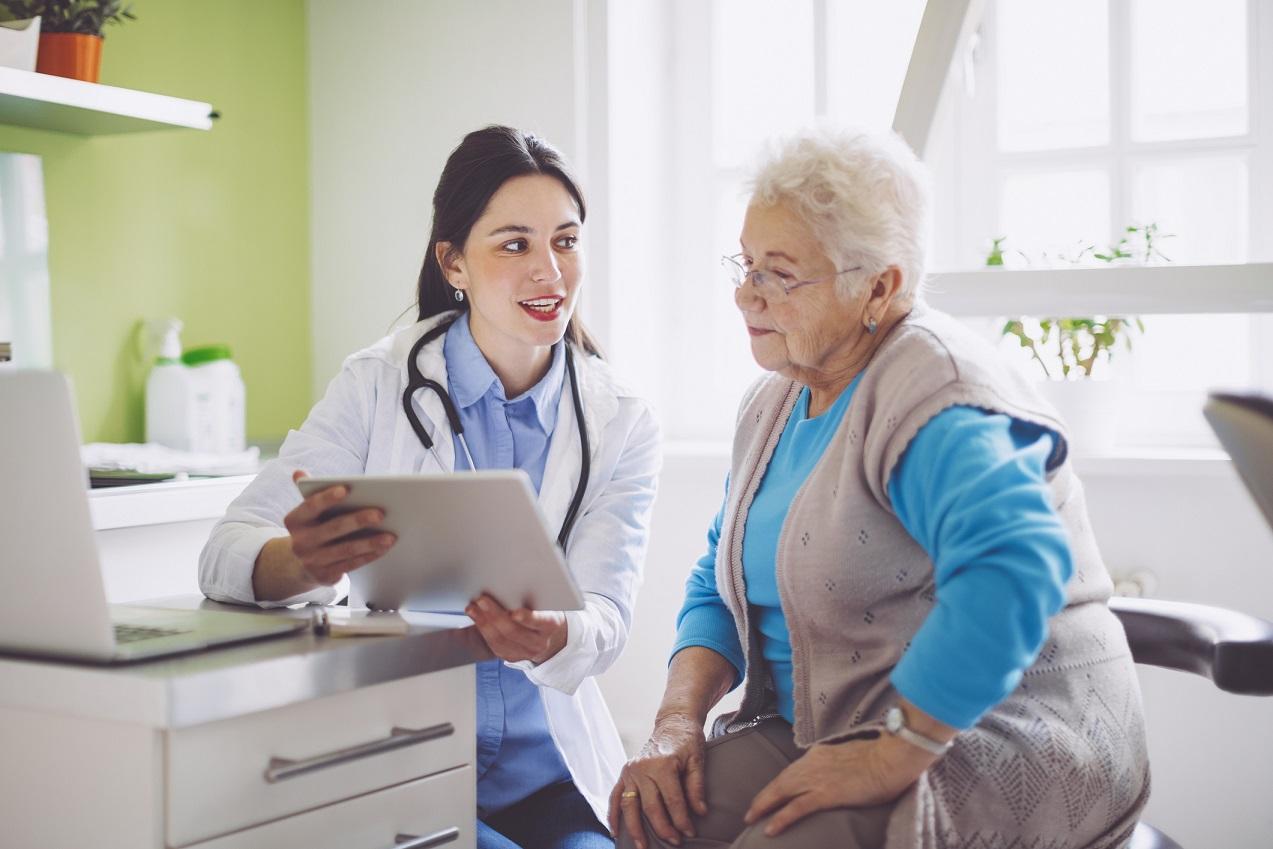 Primary care doctor consulting with patient at OneCare Medical  office