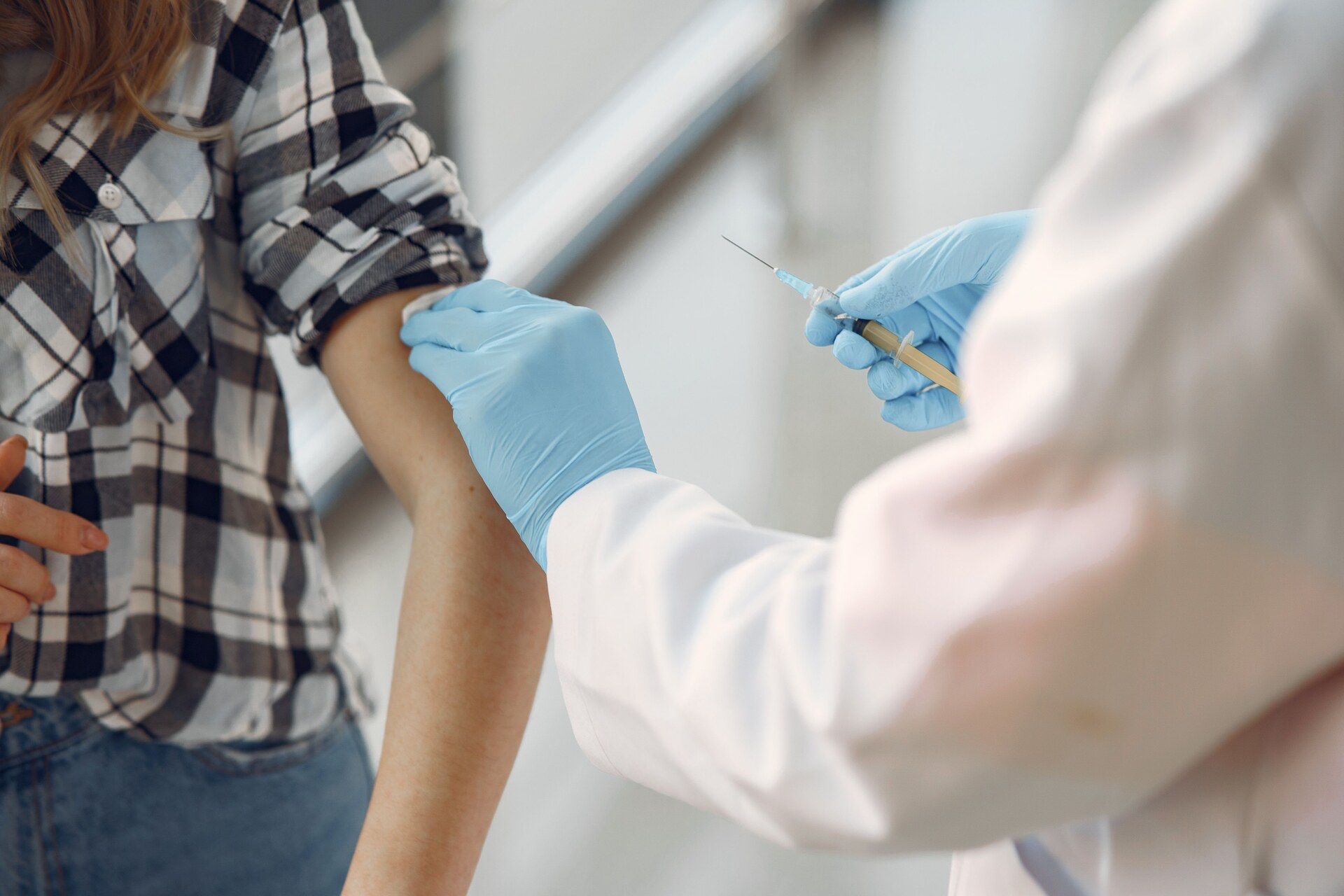 Nurse administering vaccination at OneCare Medical  clinic